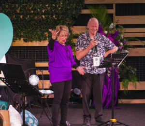 Photo of Heather and John McAlpine presenting a Connect in Kiama Conference keynote